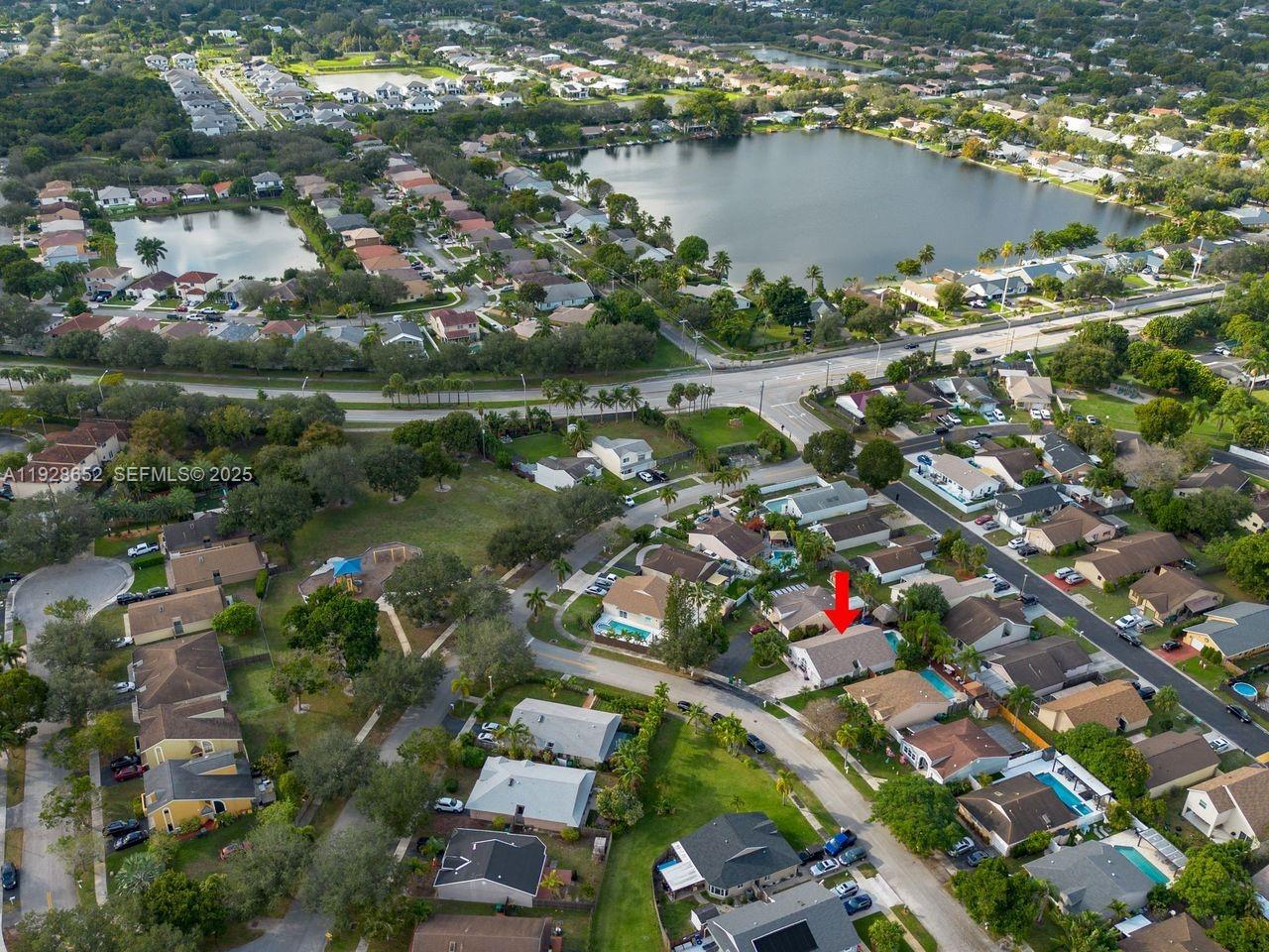 9871 Southwest 58th Court Cooper City, FL 33328 - Photo 54 of 54 an aerial view of residential houses with outdoor space and lake view