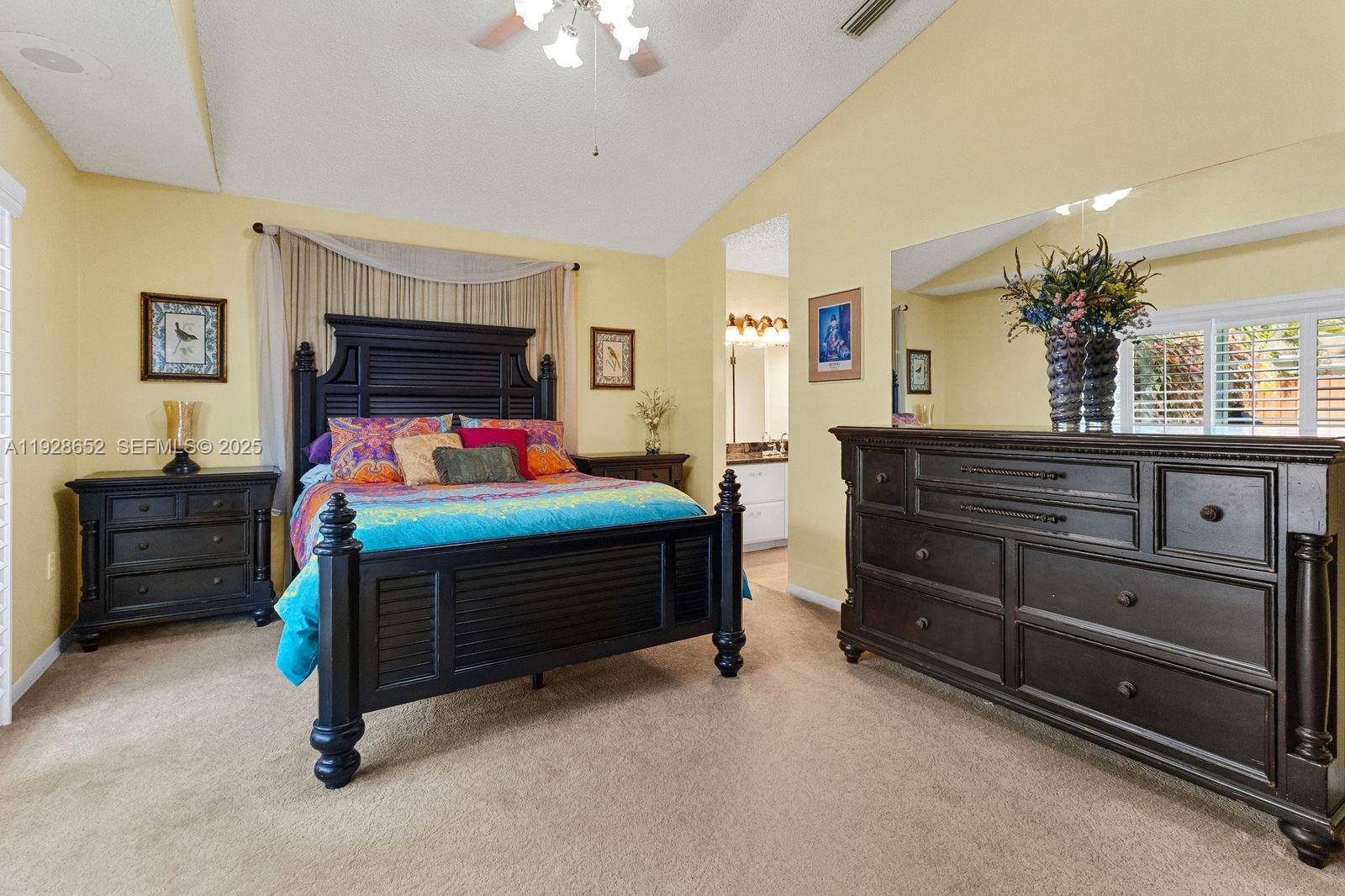 9871 Southwest 58th Court Cooper City, FL 33328 - Photo 10 of 54 a bedroom with a bed and a dresser