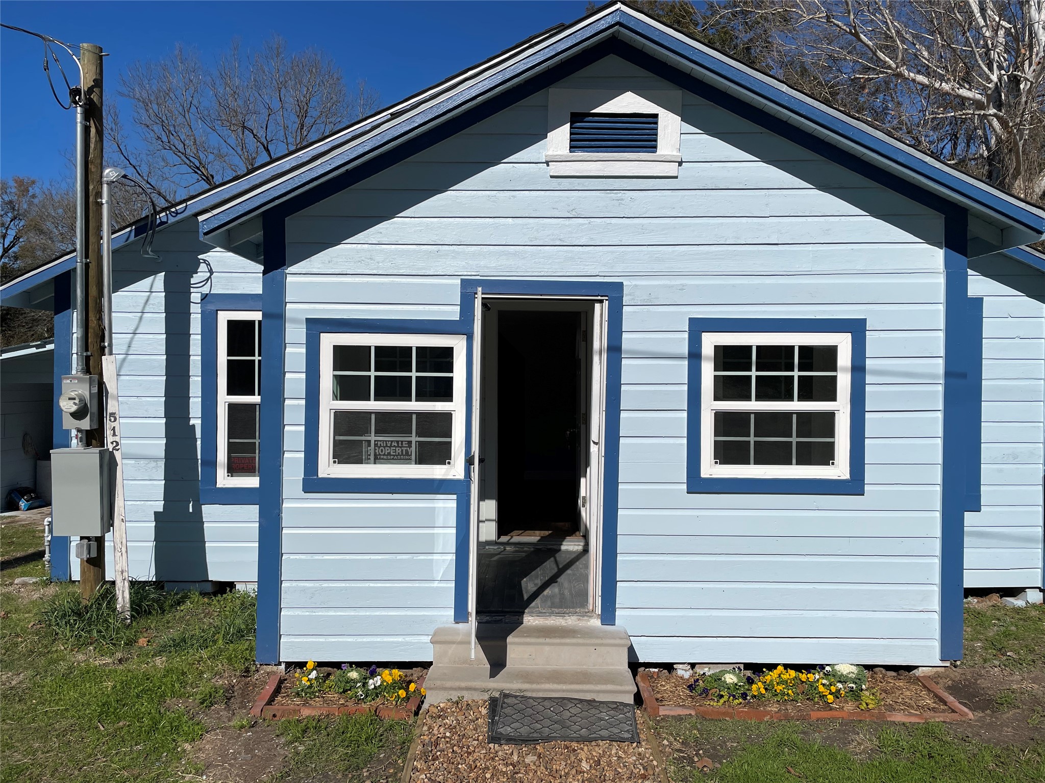 512 West 4th Street Corrigan, TX 75939 - Photo 5 of 21 a front view of a house with a garden