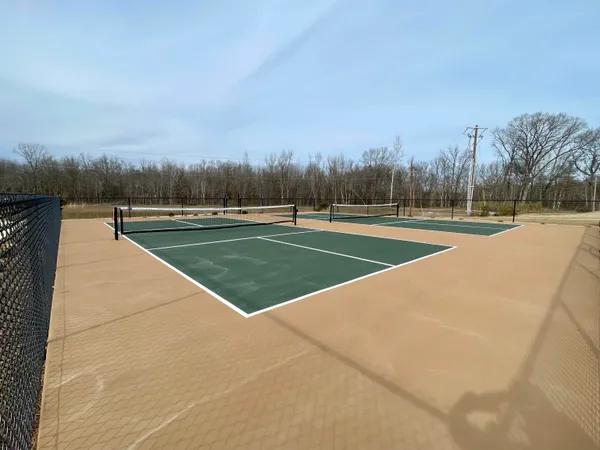 a view of an outdoor space and tennis court
