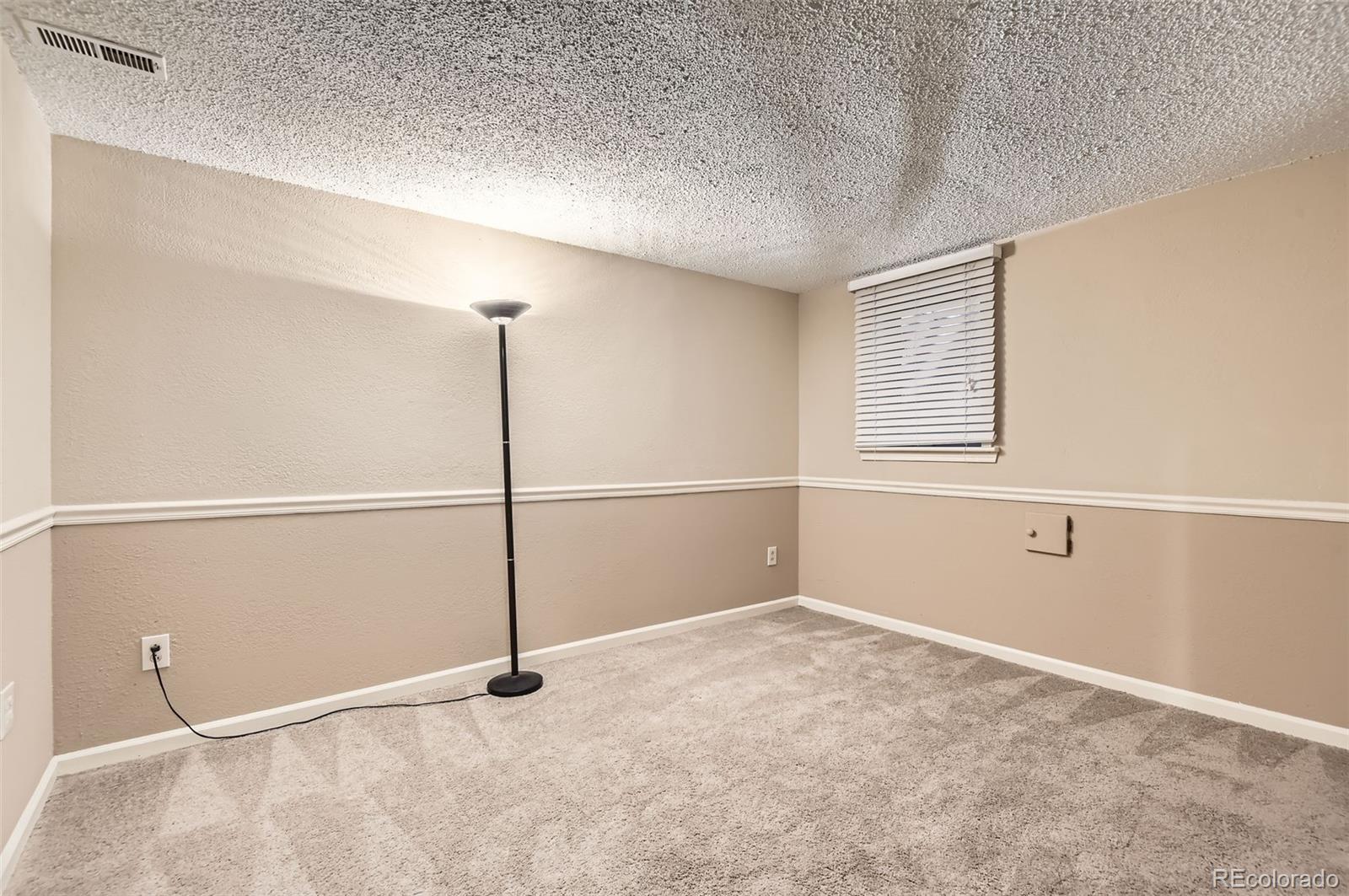 367 Jupiter Drive Lone Tree, CO 80124 - Photo 12 of 15 a view of an empty room with a window