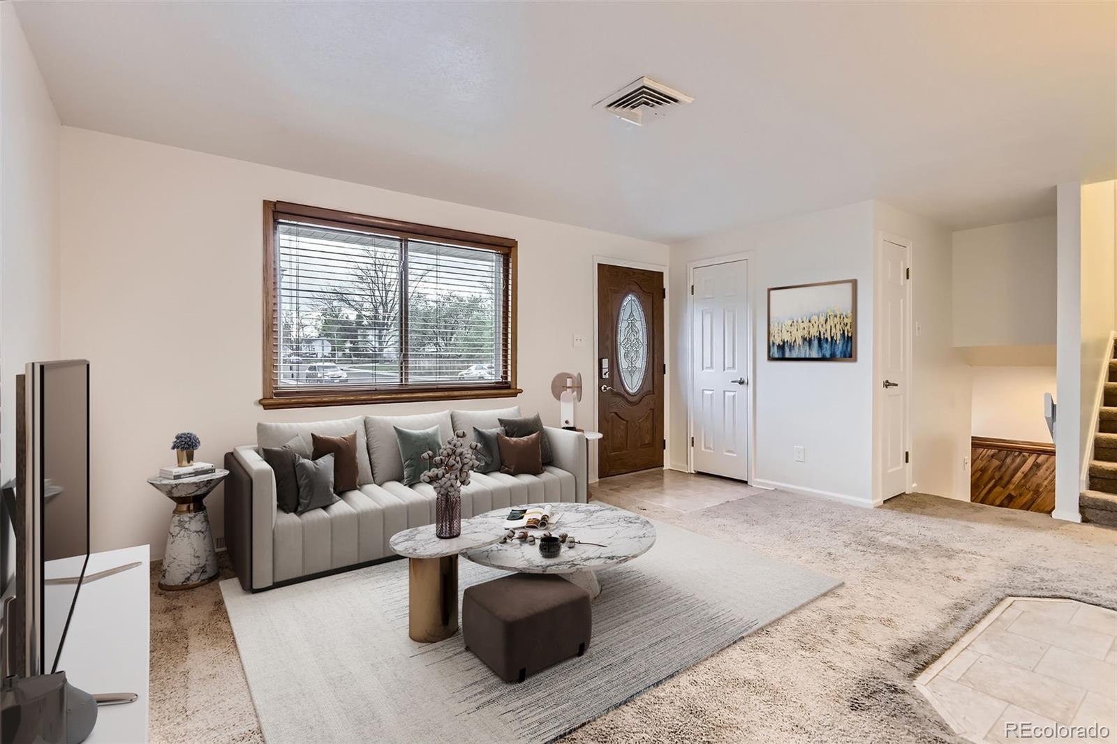 367 Jupiter Drive Lone Tree, CO 80124 - Photo 2 of 15 a living room with furniture and a fireplace