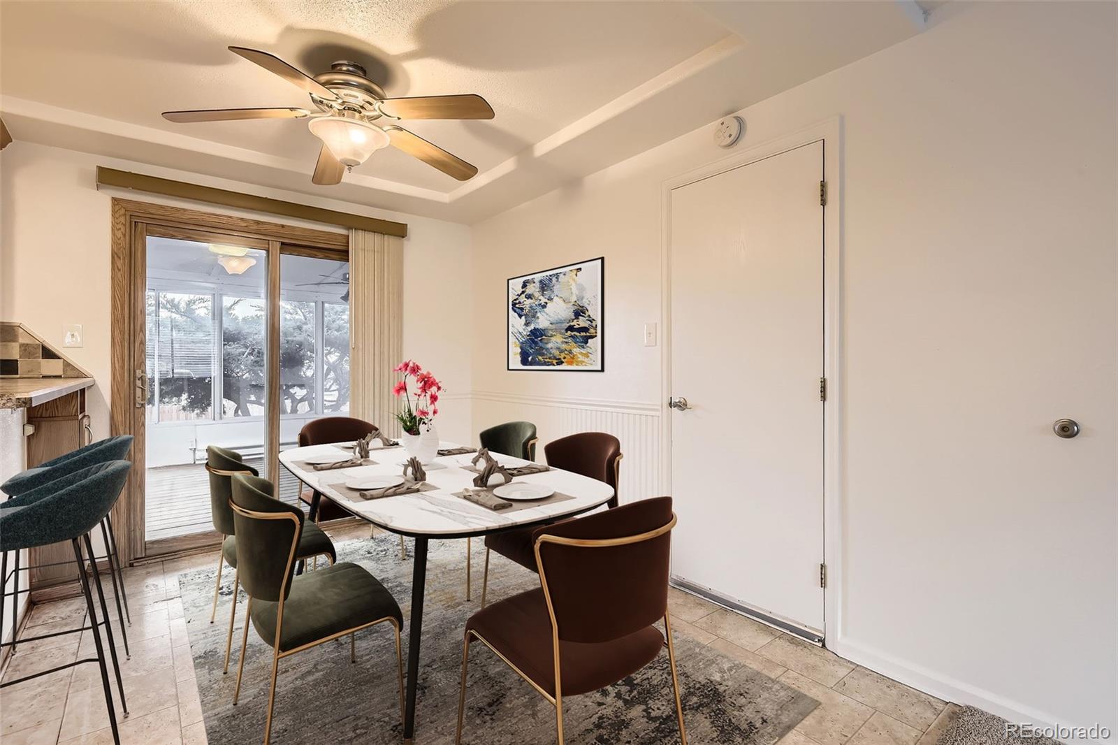 367 Jupiter Drive Lone Tree, CO 80124 - Photo 4 of 15 a dining room with furniture a chandelier and a window