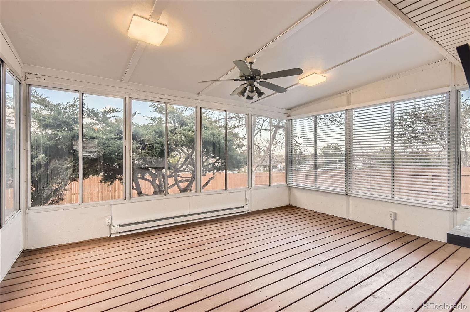 367 Jupiter Drive Lone Tree, CO 80124 - Photo 5 of 15 a view of wooden floor and windows in a room