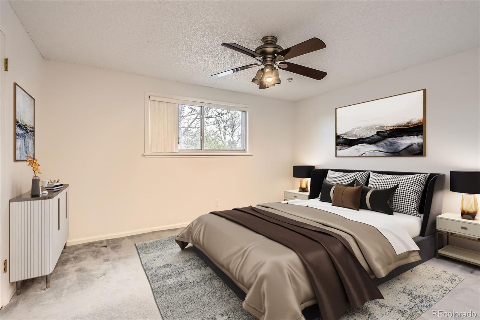 367 Jupiter Drive Lone Tree, CO 80124 - Photo 6 of 15 a bedroom with a large bed and a chandelier