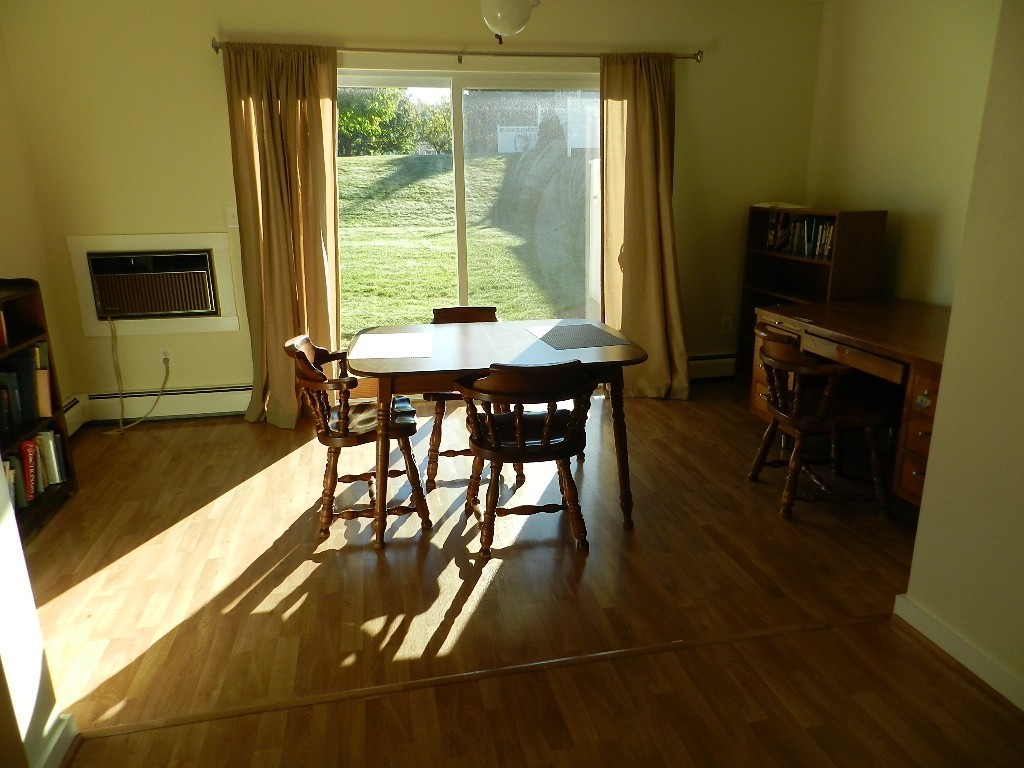 40 Wrentham Road, Unit 40 Worcester, MA 01602 - Photo 5 of 11 a view of a dining room with furniture window and outside view