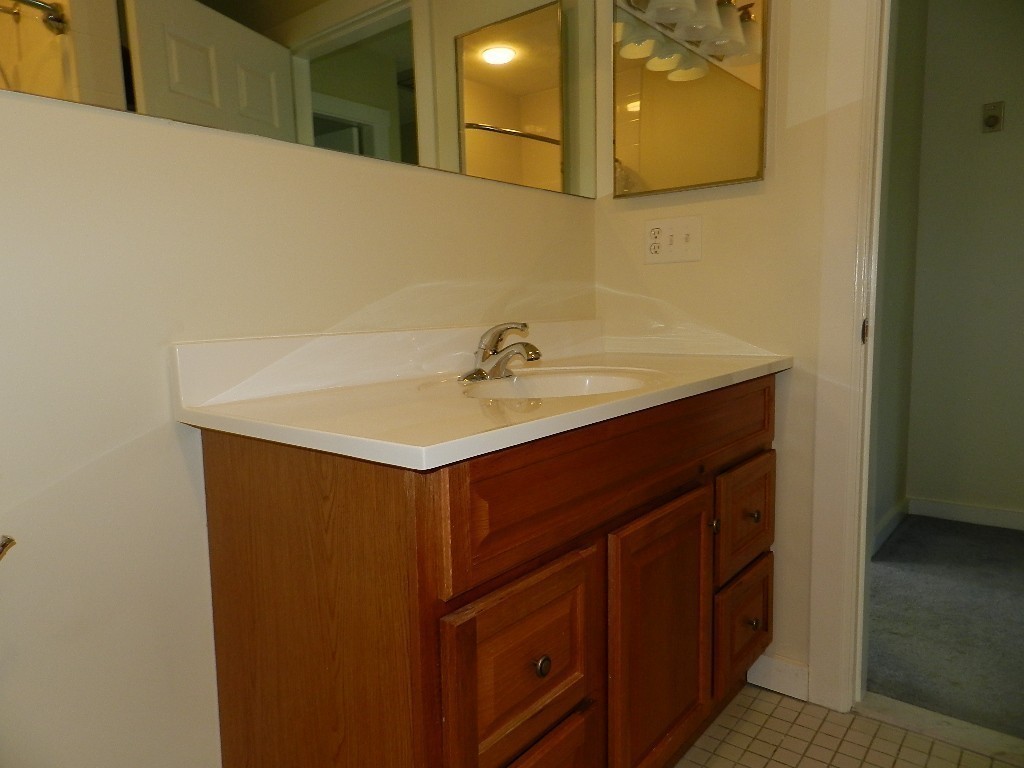 40 Wrentham Road, Unit 40 Worcester, MA 01602 - Photo 7 of 11 a bathroom with a sink and a mirror