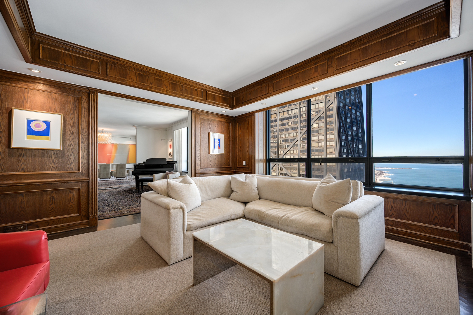 180 East Pearson Street, Unit 6802 Chicago, IL 60611 - Photo 11 of 33 a living room with furniture and a floor to ceiling window