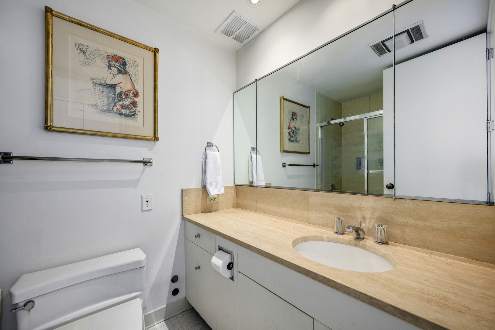 180 East Pearson Street, Unit 6802 Chicago, IL 60611 - Photo 22 of 33 a bathroom with a granite countertop sink mirror and toilet