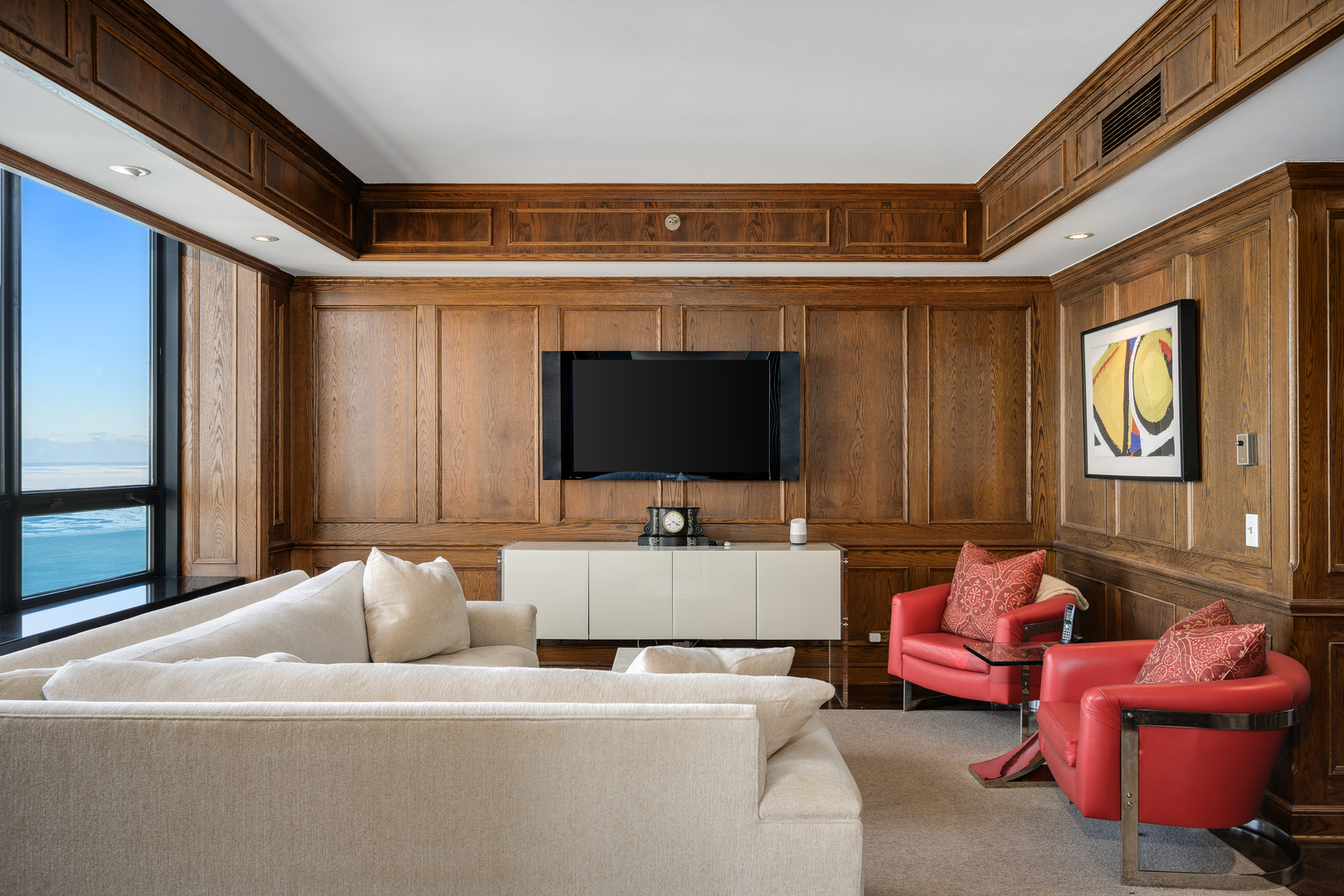 180 East Pearson Street, Unit 6802 Chicago, IL 60611 - Photo 10 of 33 a living room with furniture and a flat screen tv