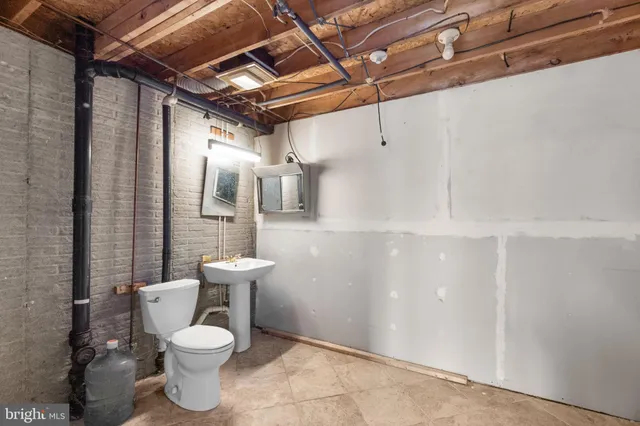 a bathroom with a toilet and a sink