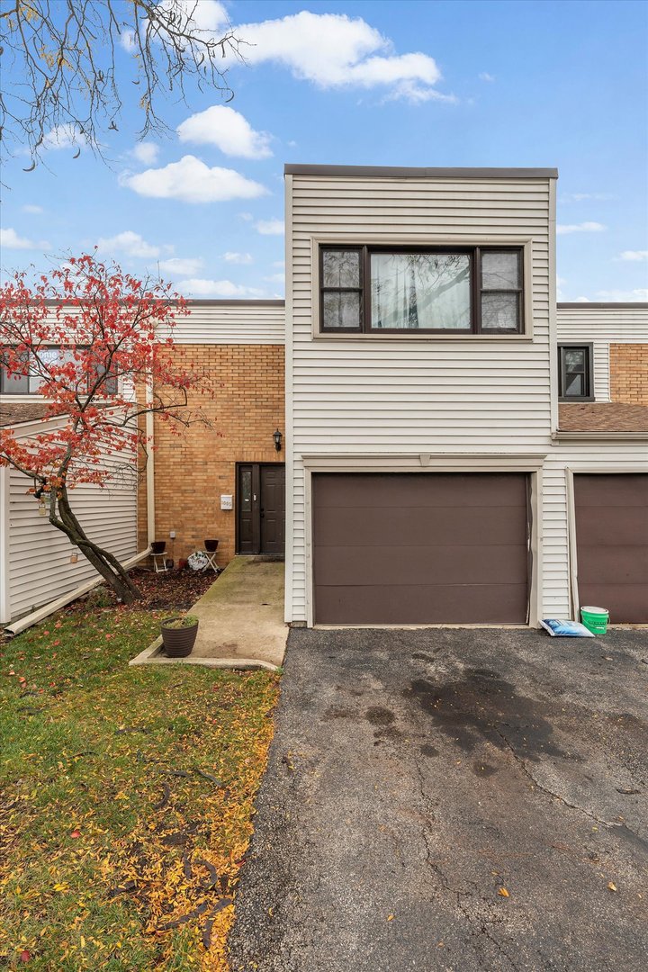 1005 Spring Mill Drive Hoffman Estates, IL 60169 - Photo 1 of 44 a view of a house with a street
