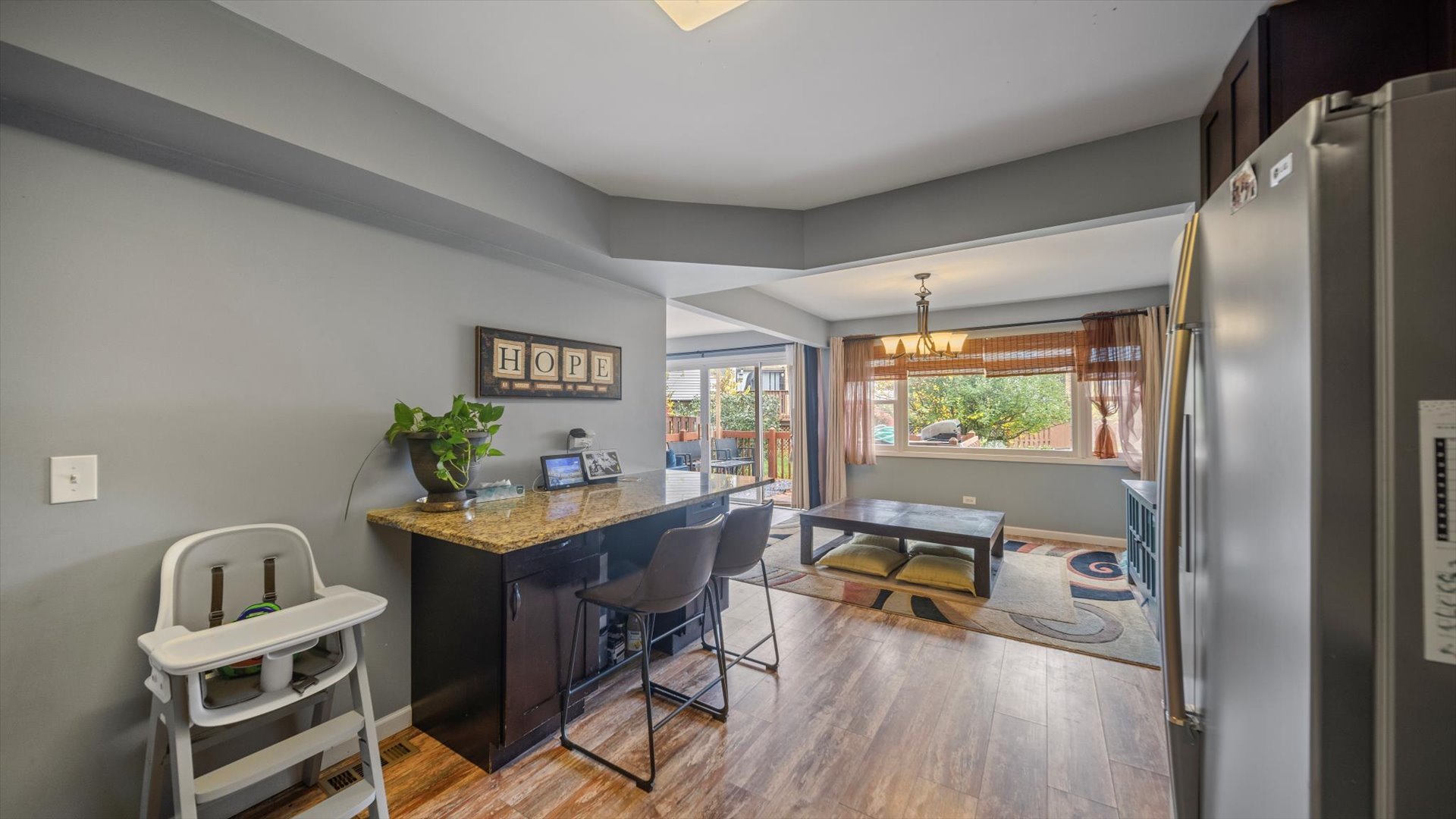 1005 Spring Mill Drive Hoffman Estates, IL 60169 - Photo 13 of 44 a view of a workspace with furniture window and wooden floor