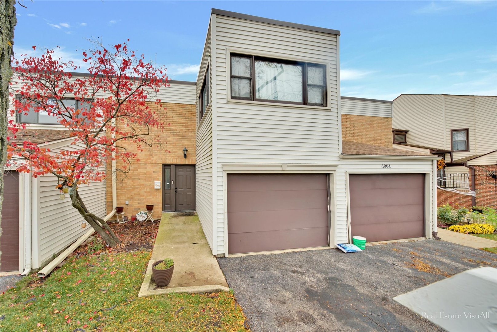1005 Spring Mill Drive Hoffman Estates, IL 60169 - Photo 2 of 44 a front view of a house with a yard