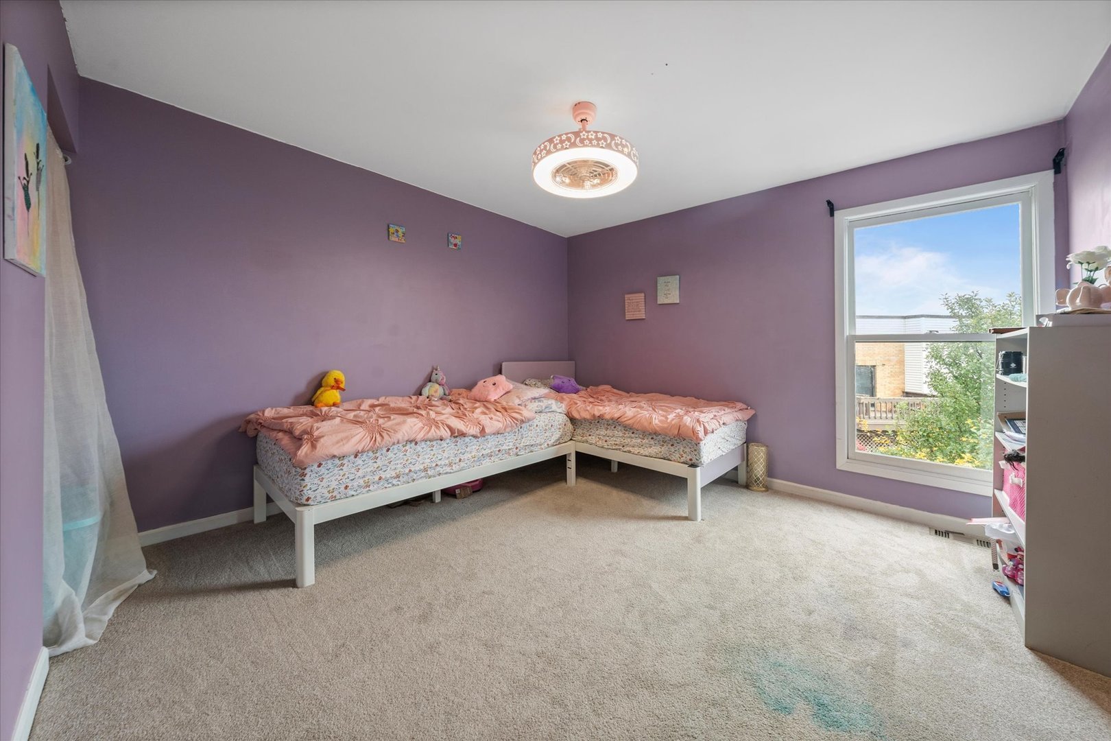 1005 Spring Mill Drive Hoffman Estates, IL 60169 - Photo 27 of 44 a bedroom with a bed and a window