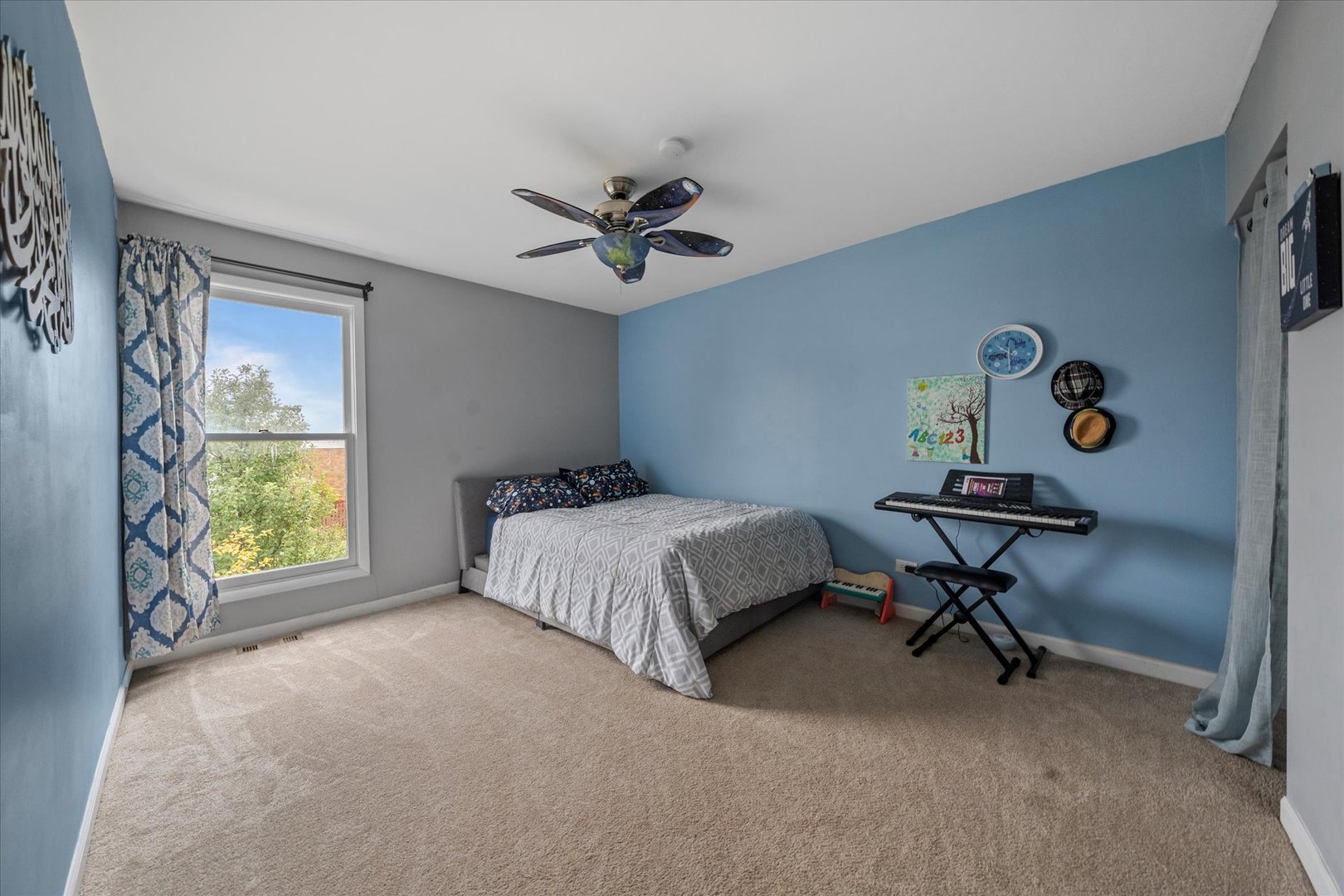1005 Spring Mill Drive Hoffman Estates, IL 60169 - Photo 28 of 44 a bedroom with a bed and a window