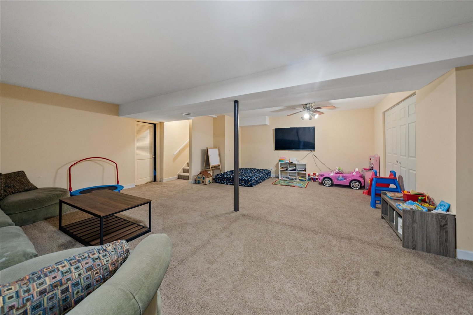1005 Spring Mill Drive Hoffman Estates, IL 60169 - Photo 31 of 44 a living room with furniture and a flat screen tv