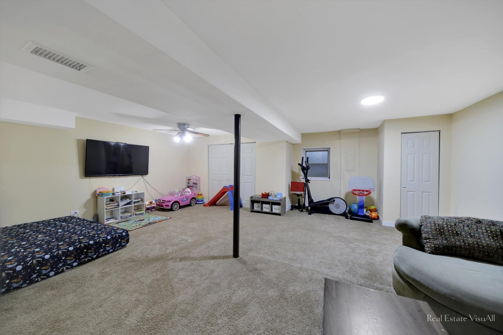 1005 Spring Mill Drive Hoffman Estates, IL 60169 - Photo 33 of 44 a view of a livingroom with furniture and a flat screen tv