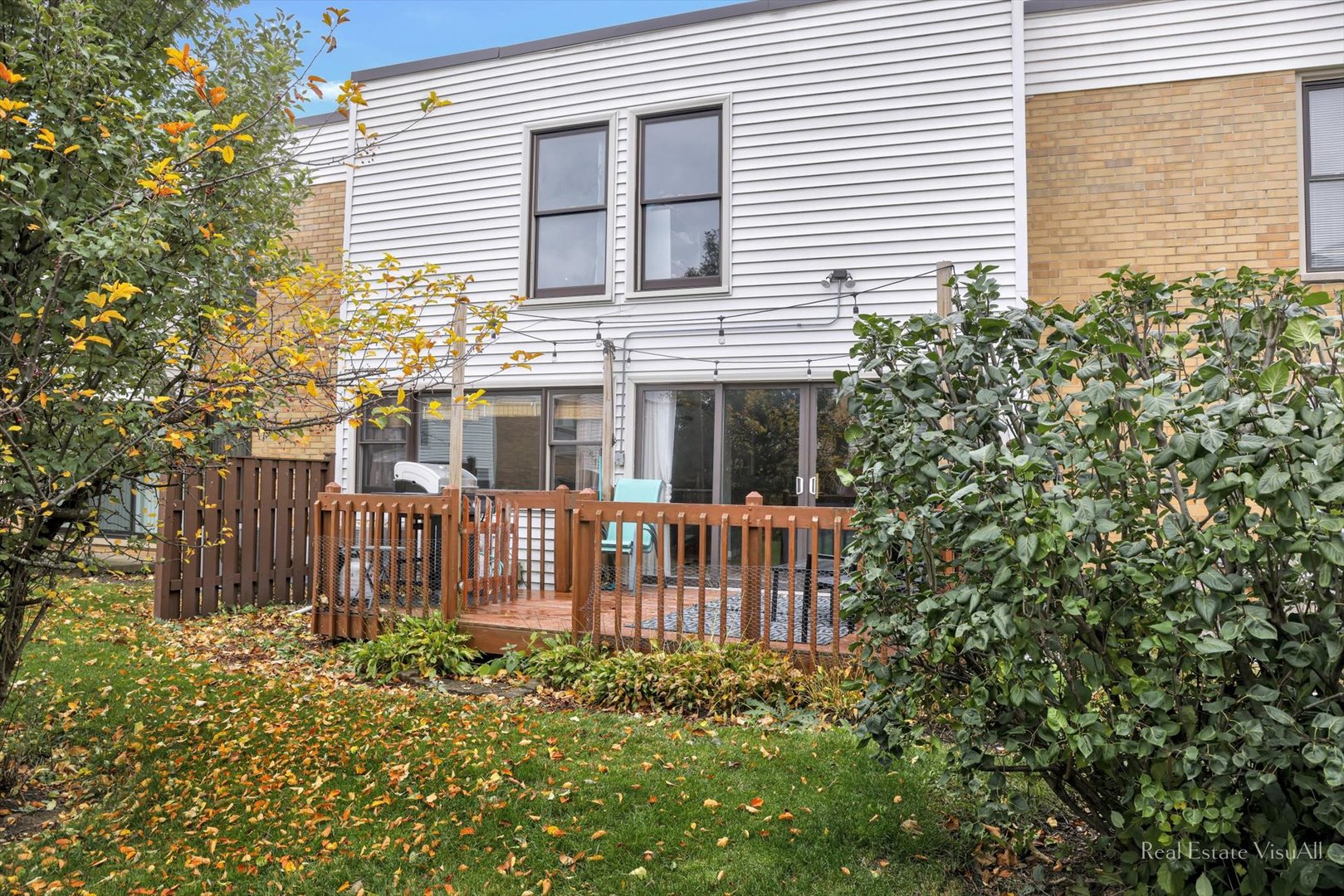 1005 Spring Mill Drive Hoffman Estates, IL 60169 - Photo 40 of 44 a view of a house with a small yard and wooden floor
