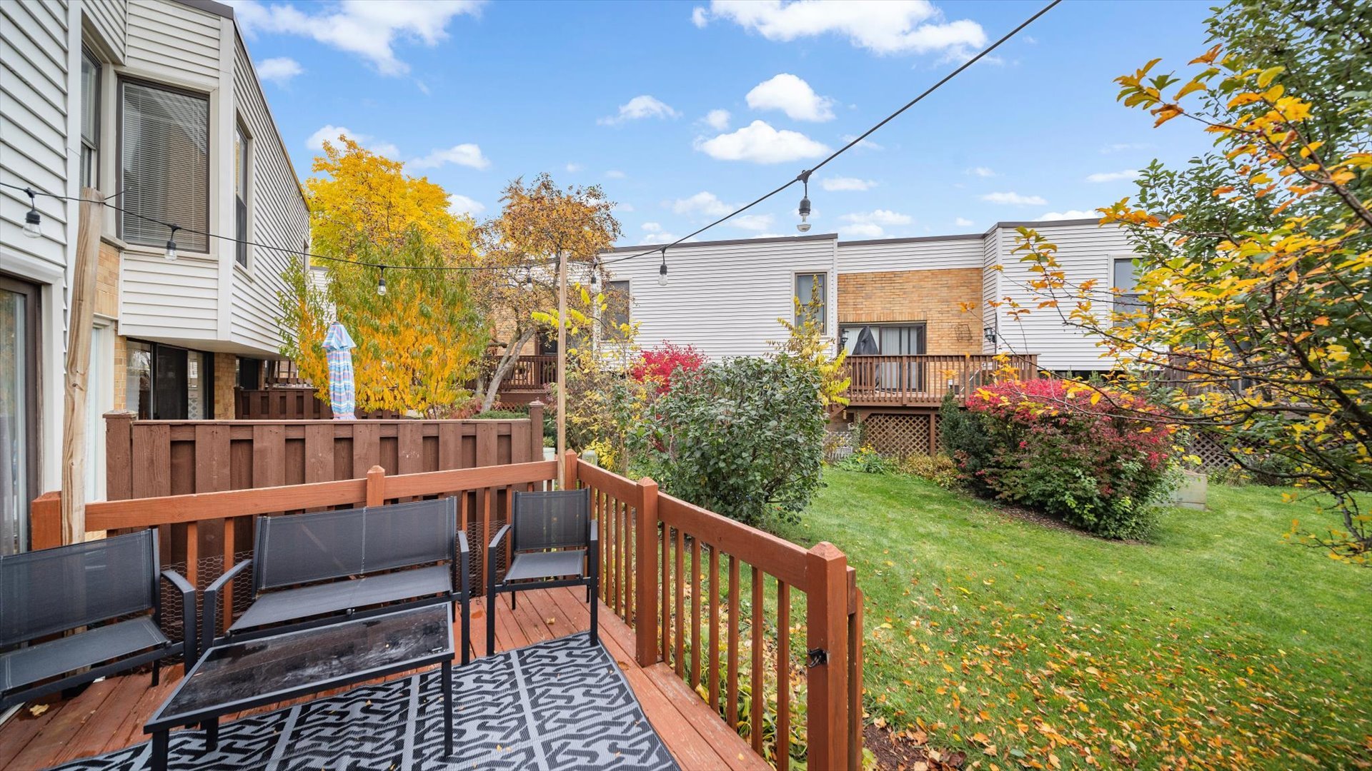1005 Spring Mill Drive Hoffman Estates, IL 60169 - Photo 43 of 44 a view of a house with backyard and porch
