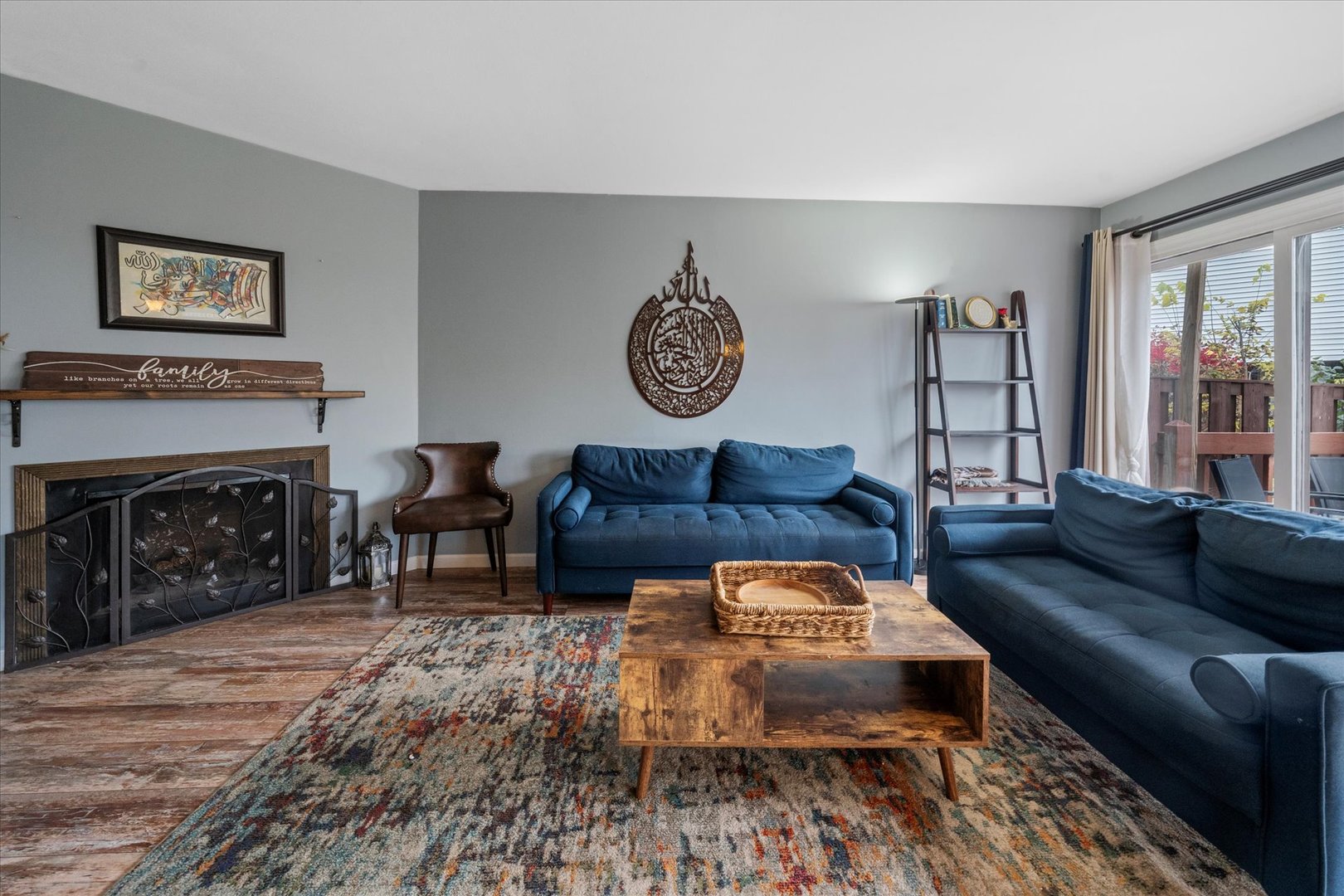 1005 Spring Mill Drive Hoffman Estates, IL 60169 - Photo 5 of 44 a living room with furniture and a fireplace