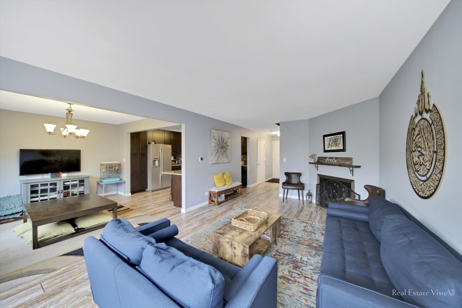 1005 Spring Mill Drive Hoffman Estates, IL 60169 - Photo 7 of 44 a living room with furniture and a flat screen tv