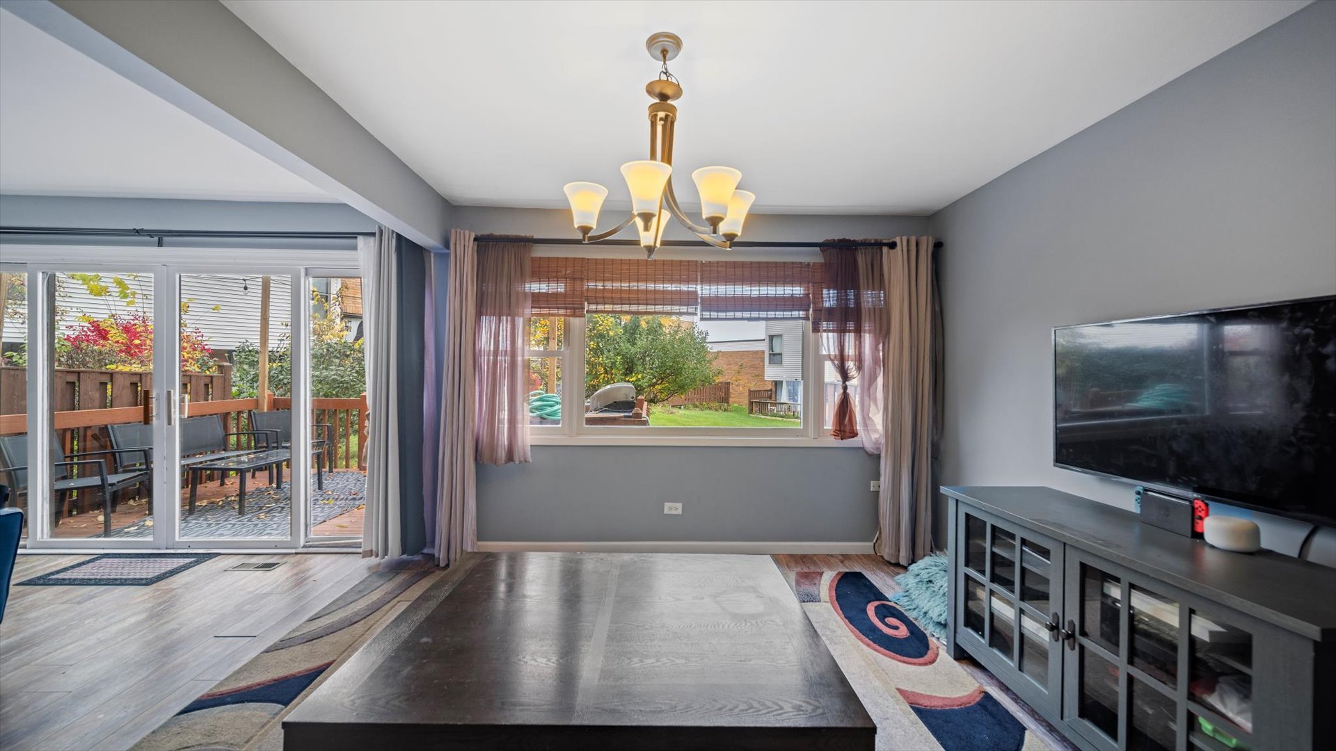 1005 Spring Mill Drive Hoffman Estates, IL 60169 - Photo 9 of 44 a living room with furniture and a flat screen tv