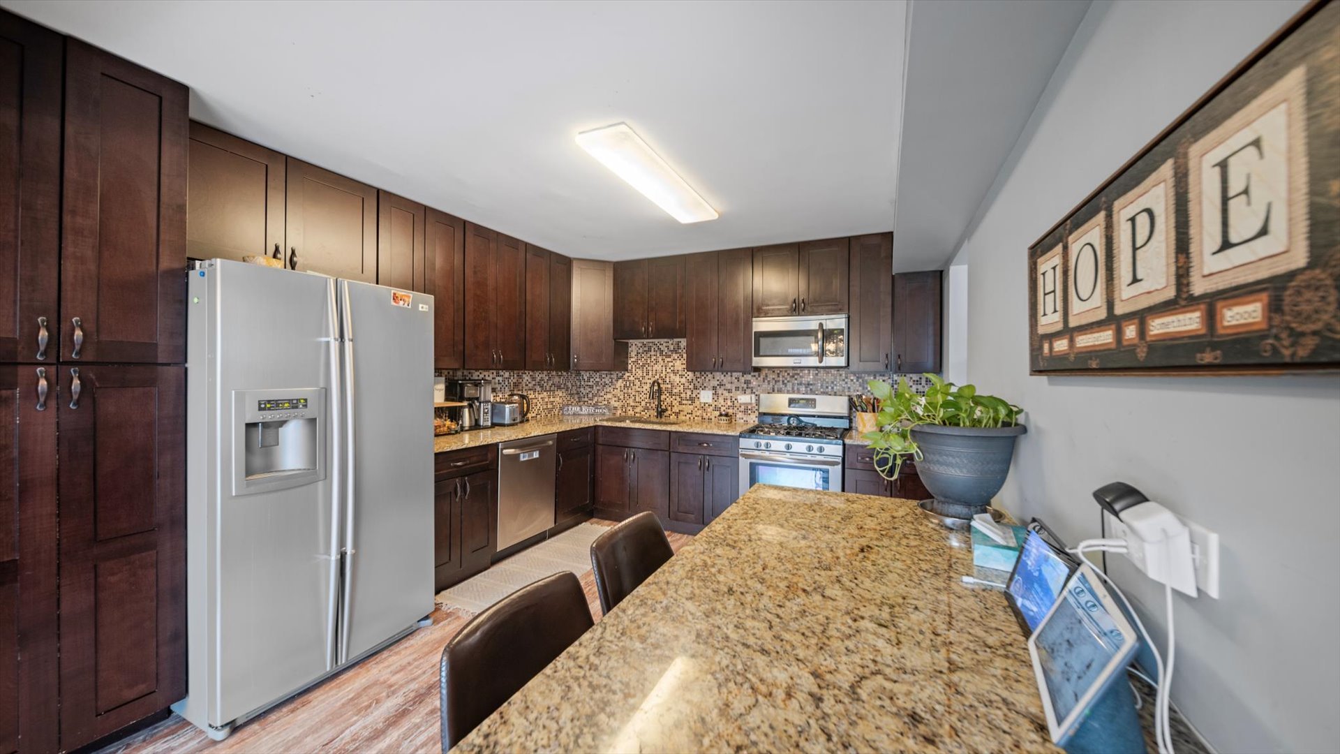 1005 Spring Mill Drive Hoffman Estates, IL 60169 - Photo 10 of 44 a kitchen with stainless steel appliances granite countertop a refrigerator a stove top oven a sink and dishwasher
