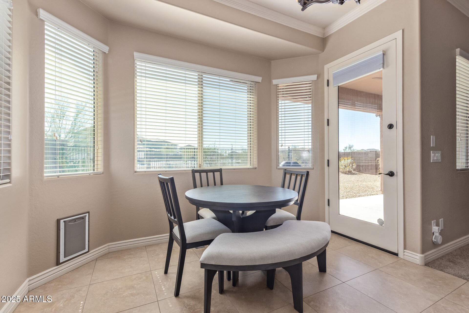 17743 West Verdin Road Goodyear, AZ 85338 - Photo 13 of 69 a dining room with furniture and window
