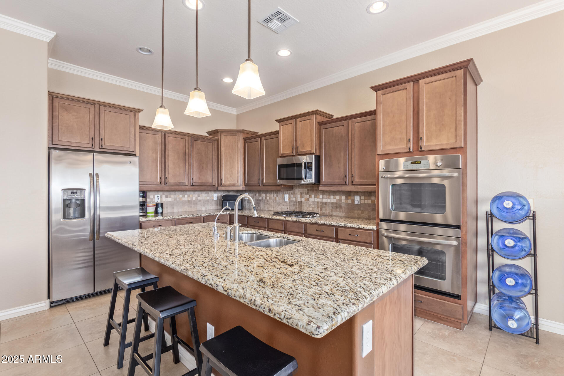 17743 West Verdin Road Goodyear, AZ 85338 - Photo 14 of 69 a kitchen with stainless steel appliances granite countertop a sink dishwasher a refrigerator and a stove