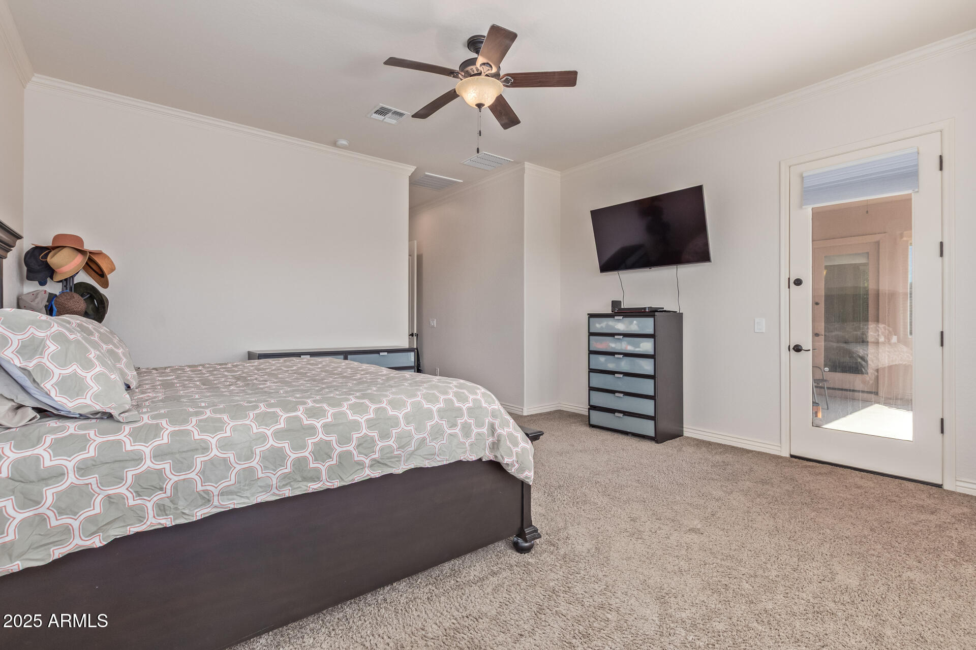 17743 West Verdin Road Goodyear, AZ 85338 - Photo 20 of 69 a bedroom with a bed and a flat screen tv