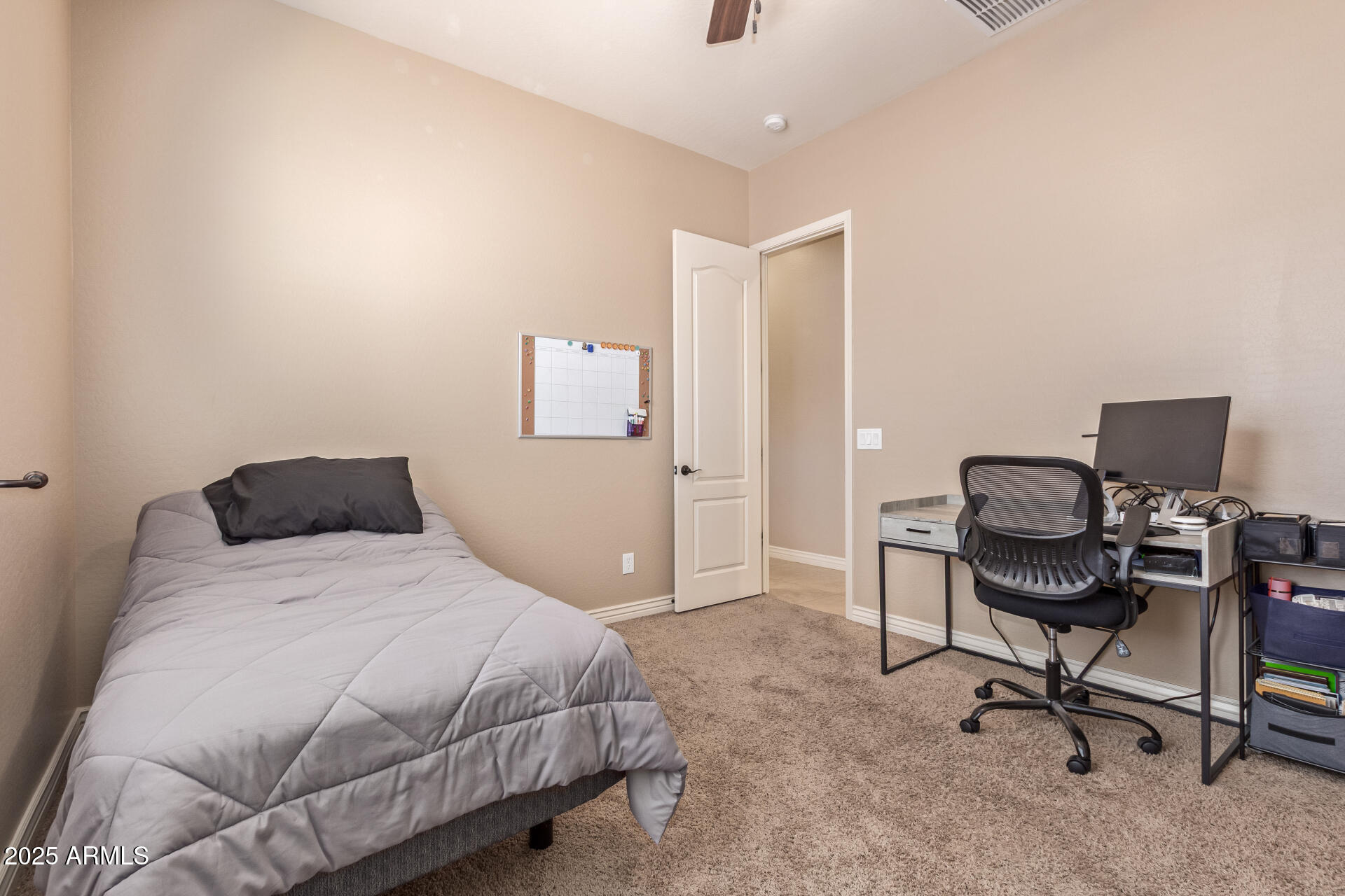 17743 West Verdin Road Goodyear, AZ 85338 - Photo 27 of 69 a bedroom with a workspace