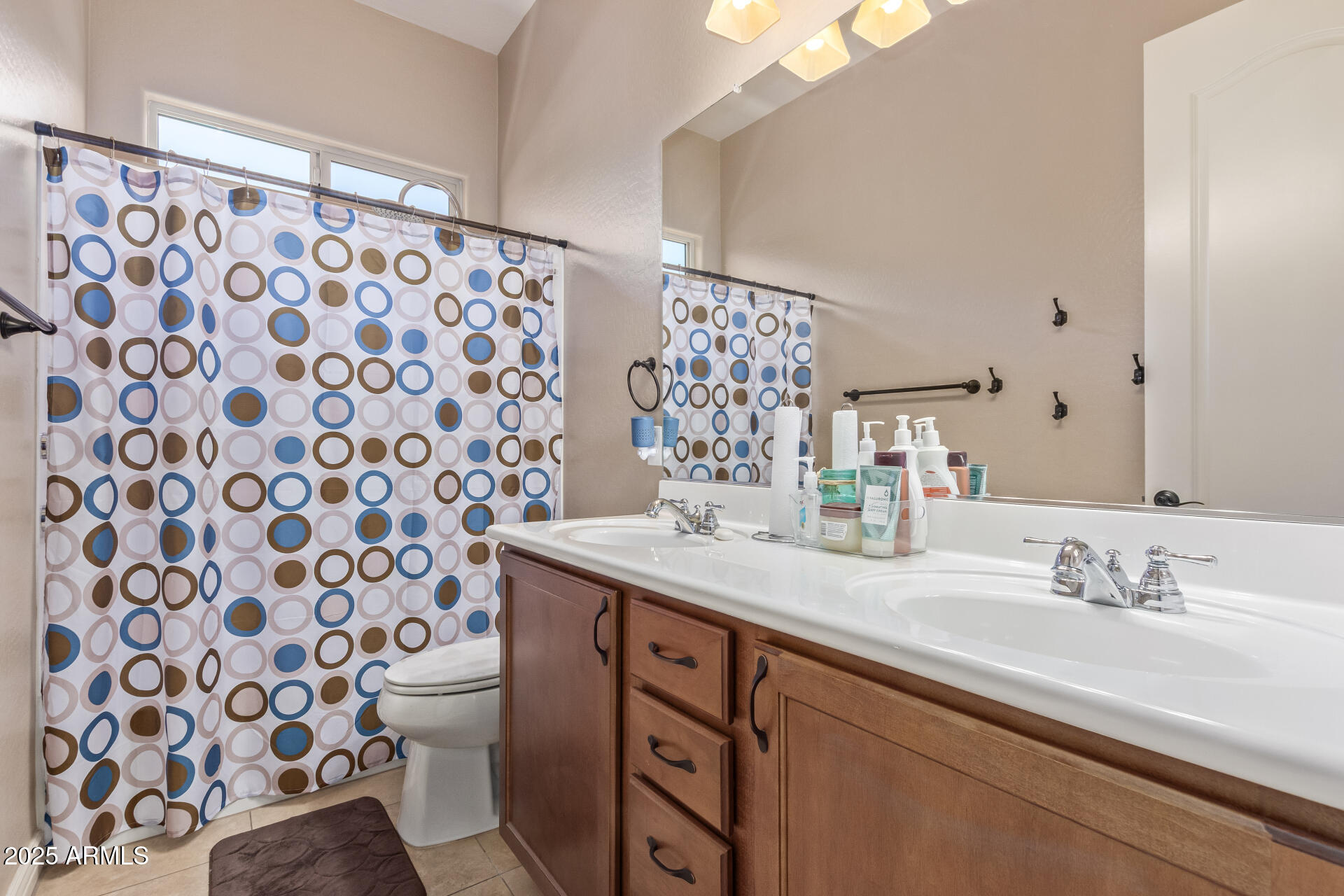 17743 West Verdin Road Goodyear, AZ 85338 - Photo 28 of 69 a bathroom with a sink toilet and shower