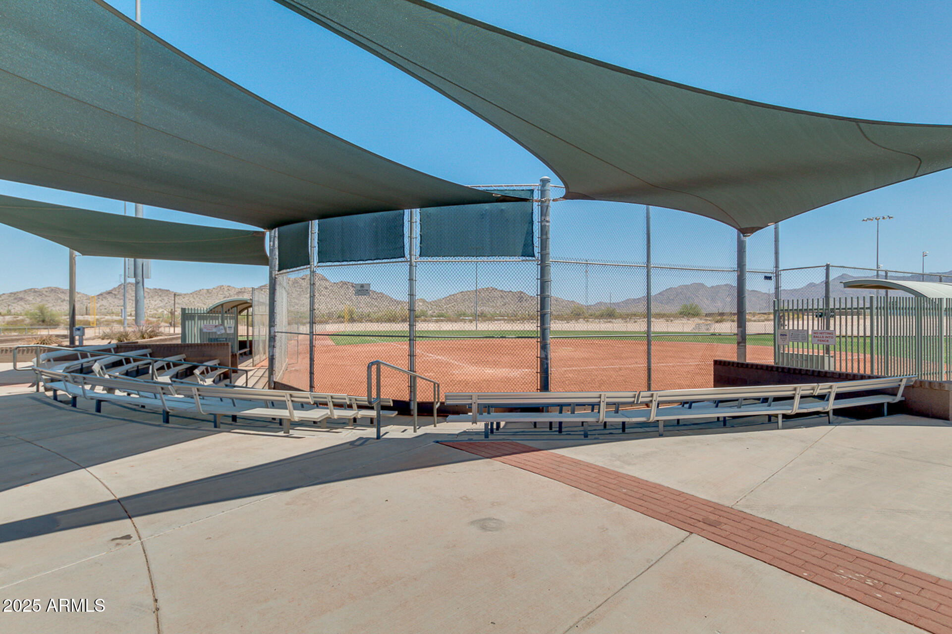 17743 West Verdin Road Goodyear, AZ 85338 - Photo 62 of 69 a view of a living room with a floor to ceiling window and an outdoor view