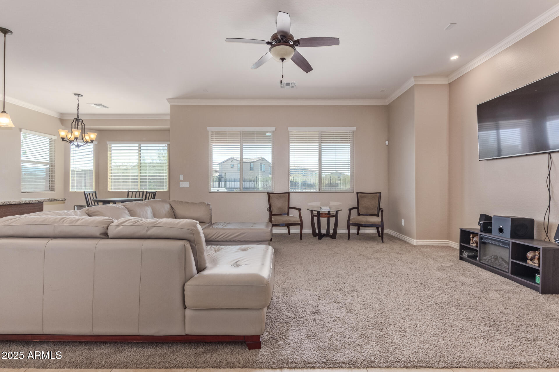 17743 West Verdin Road Goodyear, AZ 85338 - Photo 8 of 69 a living room with furniture and a large window