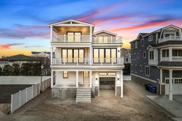 a front view of a house with a garage