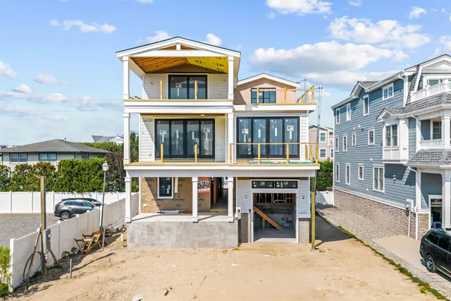 a front view of a building with a yard