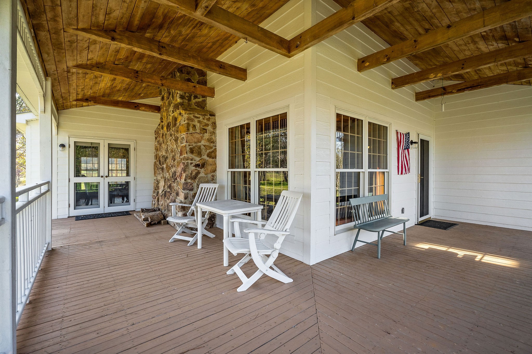 225 Apple Valley Lane Morrison, TN 37357 - Photo 13 of 74 a view of a porch with a table and chairs