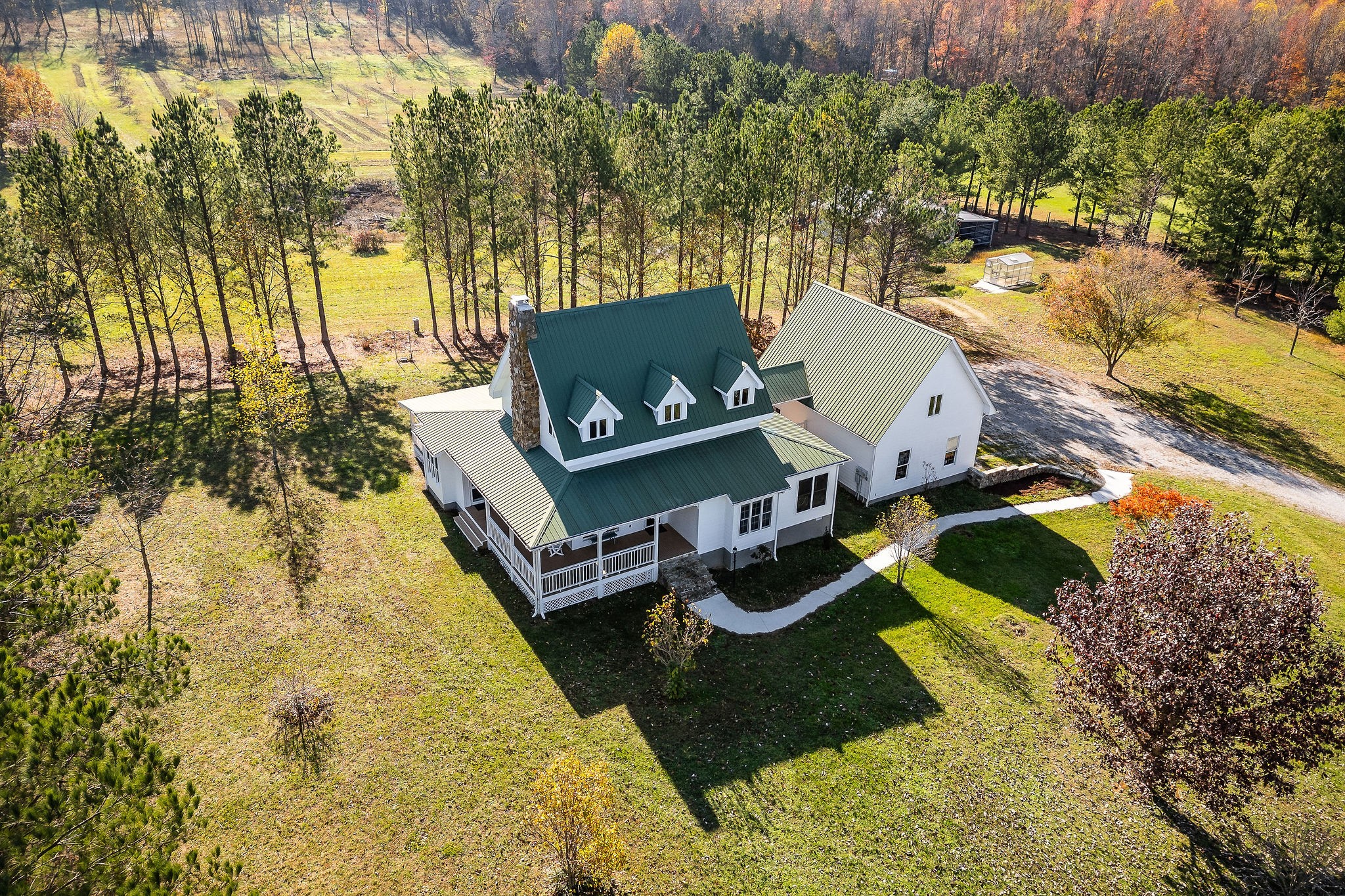 225 Apple Valley Lane Morrison, TN 37357 - Photo 2 of 74 an aerial view of a house with swimming pool and large trees