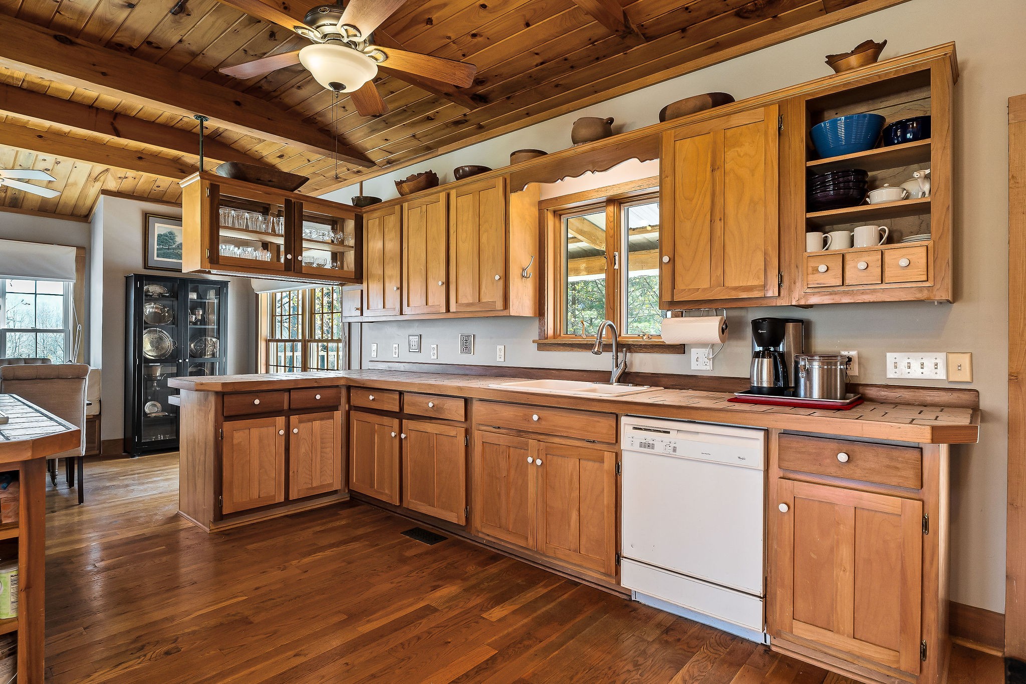 225 Apple Valley Lane Morrison, TN 37357 - Photo 25 of 74 a kitchen with stainless steel appliances granite countertop wooden floors a stove and white cabinets