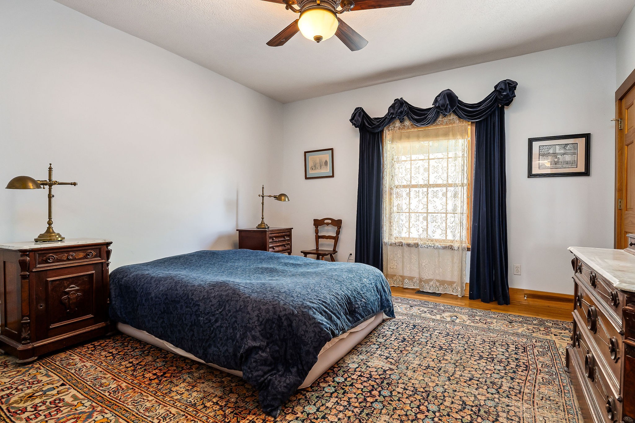 225 Apple Valley Lane Morrison, TN 37357 - Photo 35 of 74 a bedroom with a bed and a chandelier
