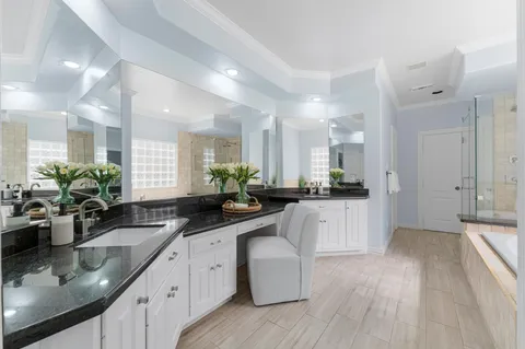 a kitchen with stainless steel appliances granite countertop a stove and a sink