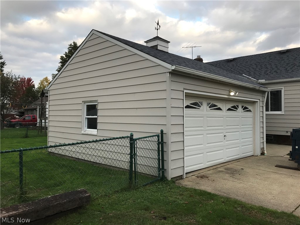 6564 Ridgewood Lakes Drive Parma, OH 44129 - Photo 5 of 33 2 car garage with opener. House and garage roof is approximately 15 yrs
