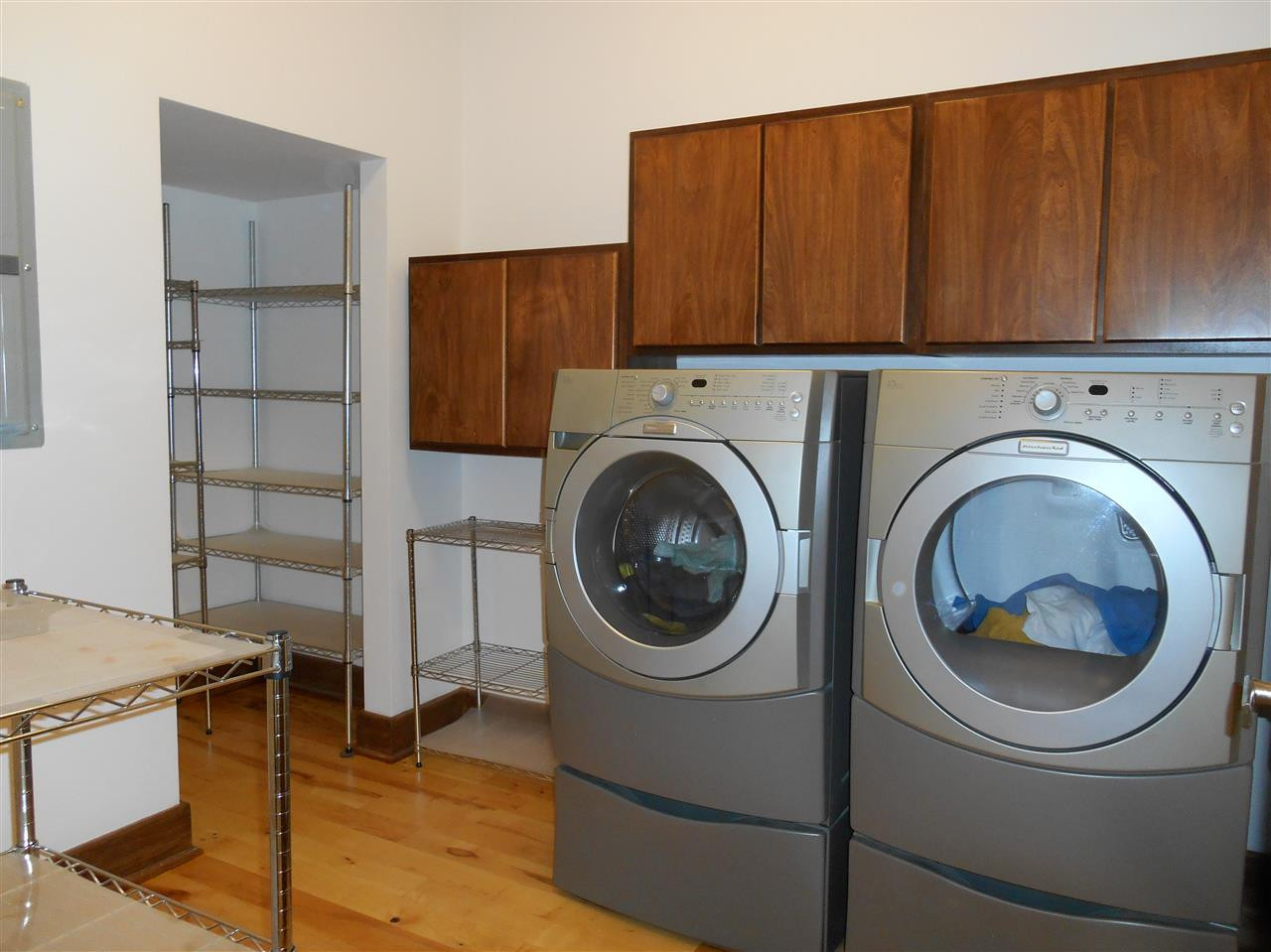 515 Euclid Street Raleigh, NC 27604 - Photo 15 of 24 Cabinets at different levels. Machines stay with house, if desired. Extra storage below each. Racks for additional pantry space. Laundry room