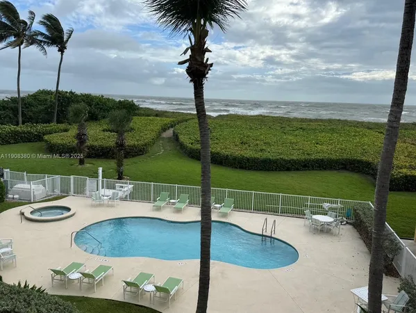 a view of a swimming pool with a lake view