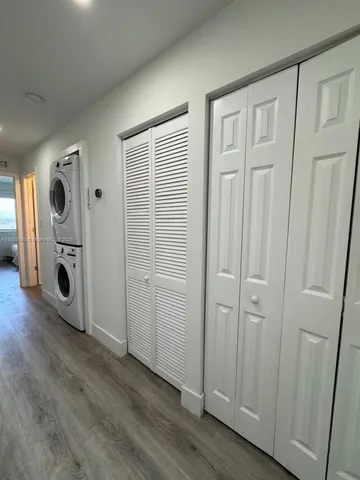 an entryway with wooden floor