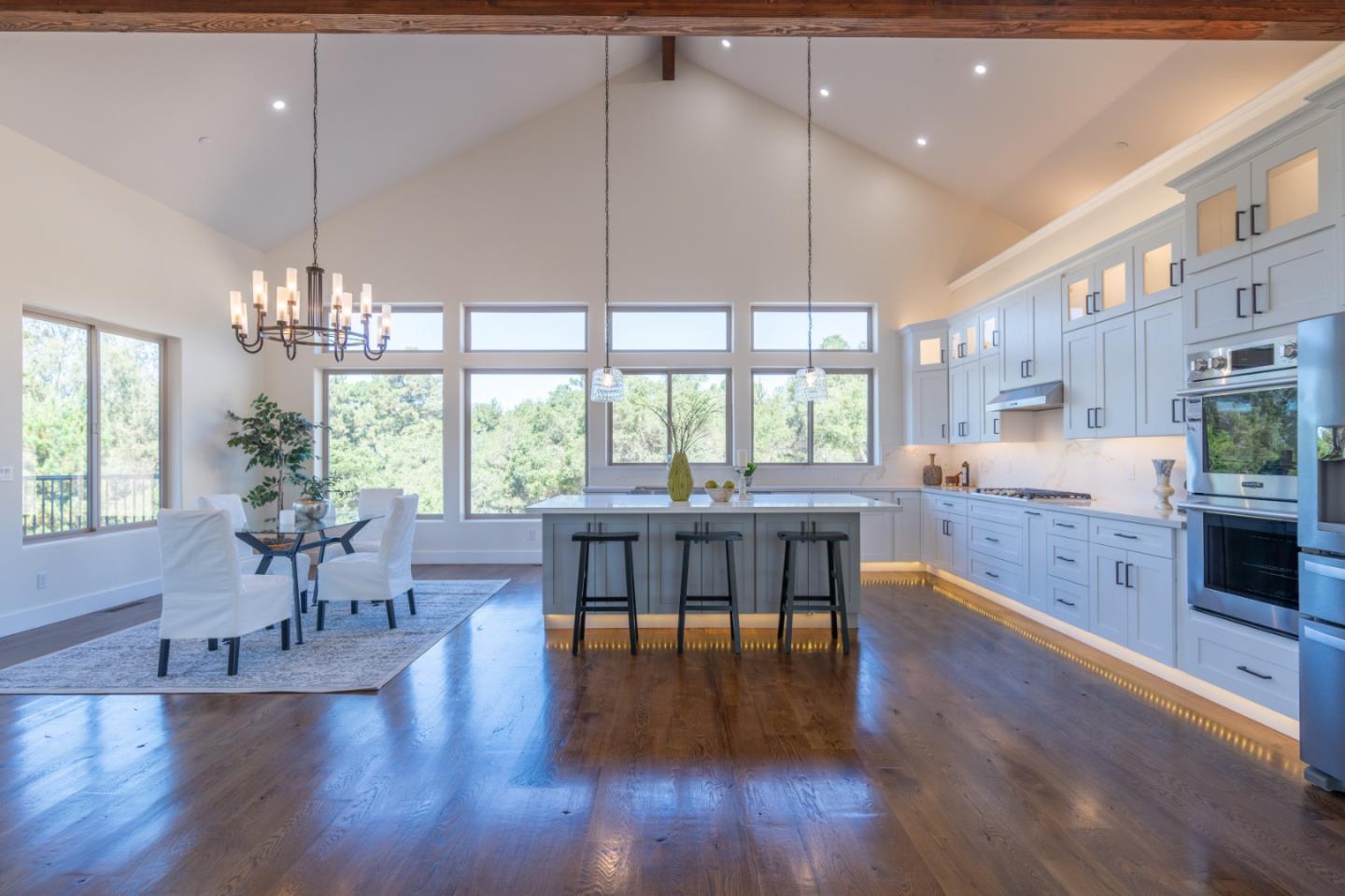 9020 Hidden Canyon Road Salinas, CA 93907 - Photo 18 of 58 a kitchen with lots of counter top space and dining table