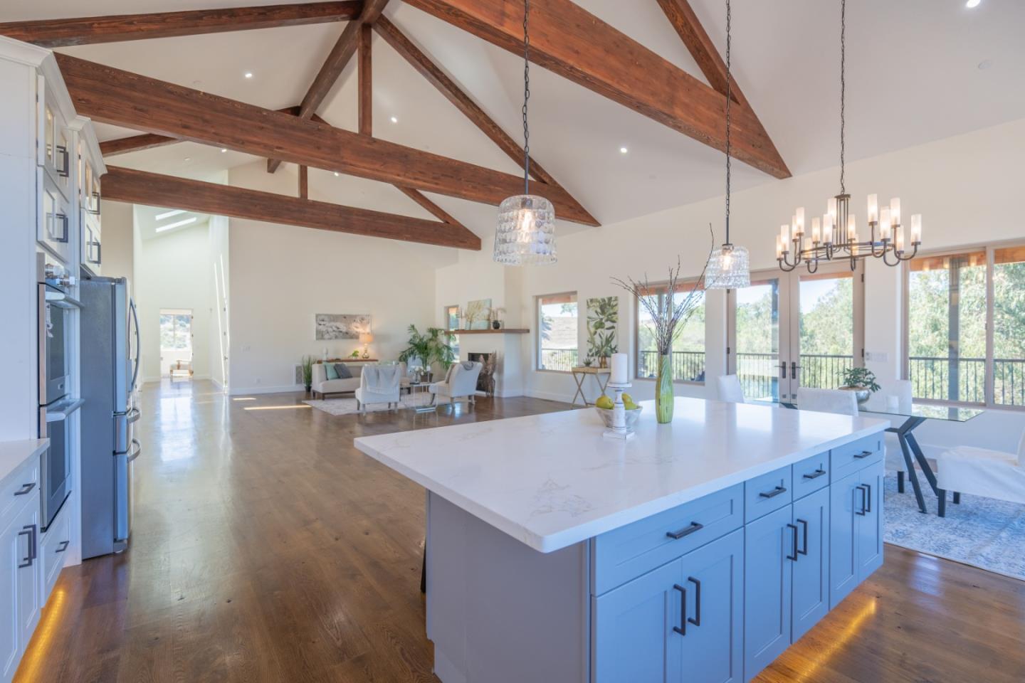9020 Hidden Canyon Road Salinas, CA 93907 - Photo 24 of 58 a large kitchen with kitchen island a large island a sink stainless steel appliances and cabinets