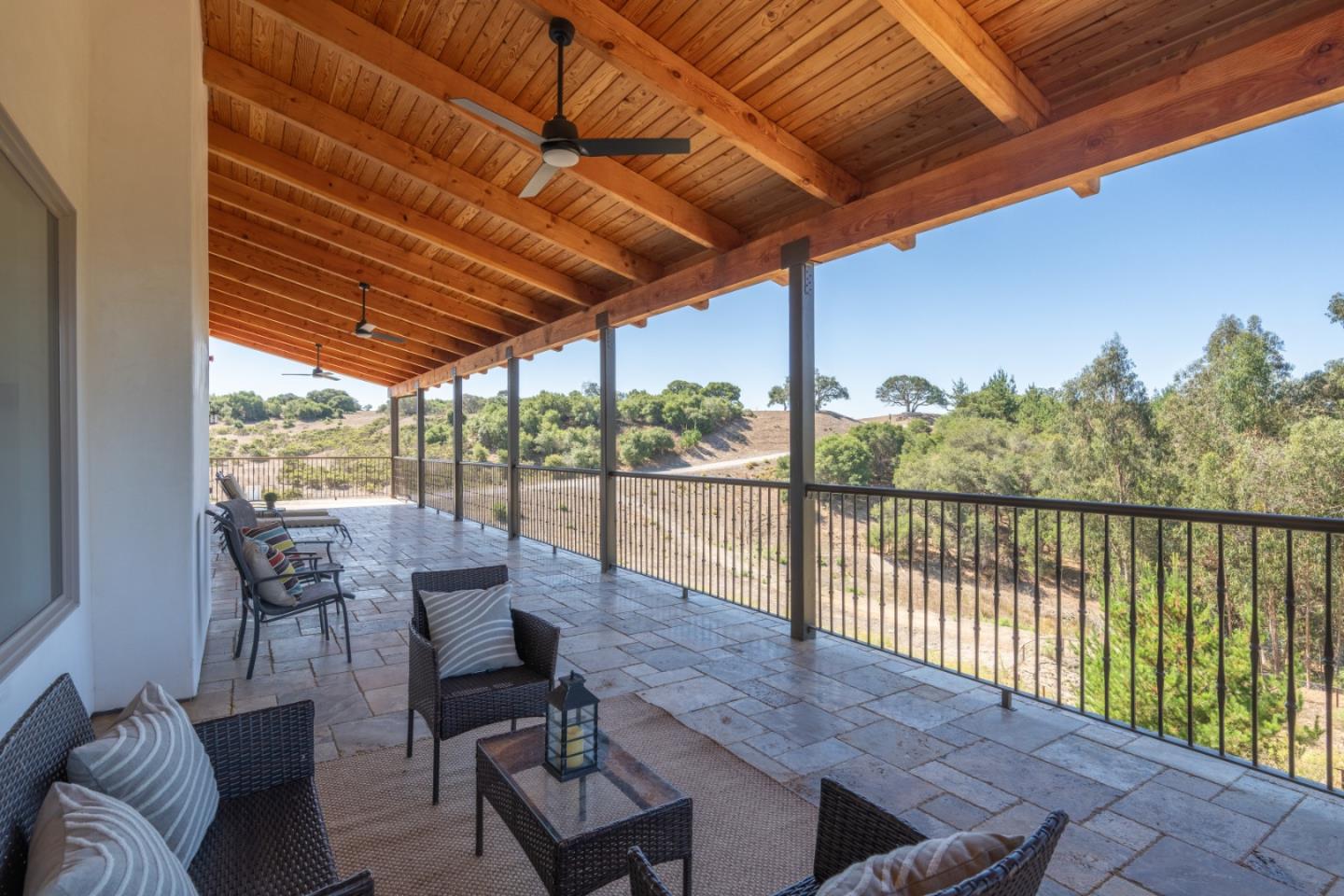 9020 Hidden Canyon Road Salinas, CA 93907 - Photo 27 of 58 a balcony with furniture and wooden floor