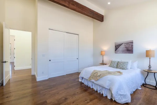 a view of an entryway with wooden floor